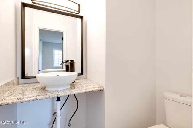 bathroom with a sink and toilet