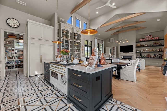 628 E Harborside Rd, Oriental, NC 28571 - kitchen with paneled built in fridge, visible vents, white cabinets, and high vaulted ceiling