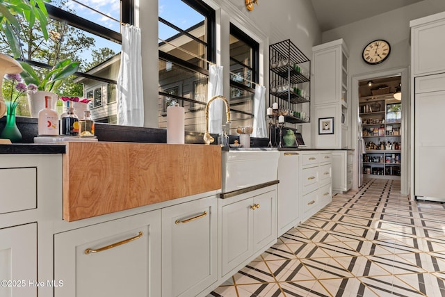628 E Harborside Rd, Oriental, NC 28571 - kitchen featuring white cabinetry and light tile patterned floors