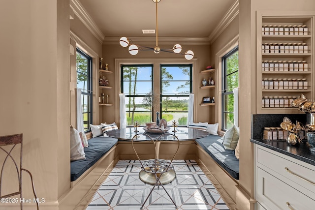 628 E Harborside Rd, Oriental, NC 28571 - interior space with an inviting chandelier and crown molding