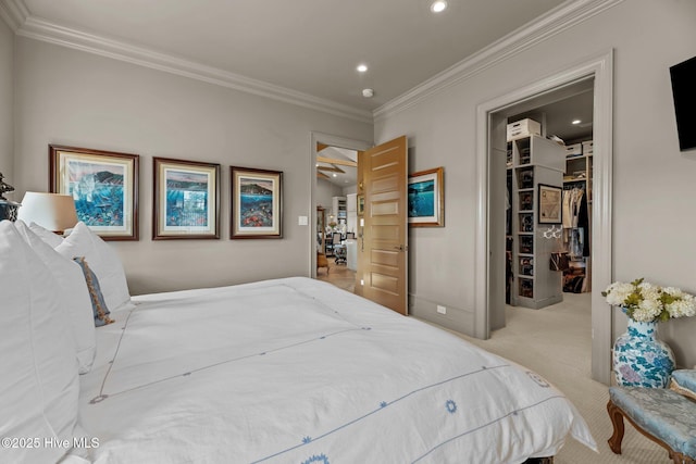 628 E Harborside Rd, Oriental, NC 28571 - carpeted bedroom featuring a walk in closet, ornamental molding, a closet, and recessed lighting