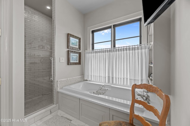628 E Harborside Rd, Oriental, NC 28571 - full bathroom with a garden tub, marble finish floor, a stall shower, and recessed lighting
