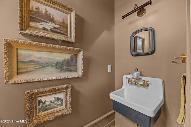 628 E Harborside Rd, Oriental, NC 28571 - bathroom featuring a sink and baseboards