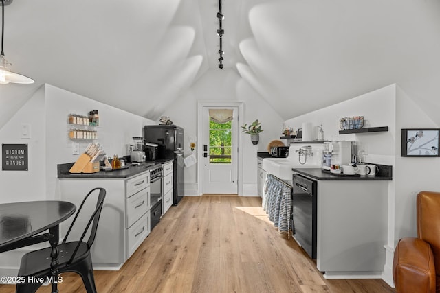 628 E Harborside Rd, Oriental, NC 28571 - kitchen with open shelves, black appliances, vaulted ceiling, light wood finished floors, and dark countertops