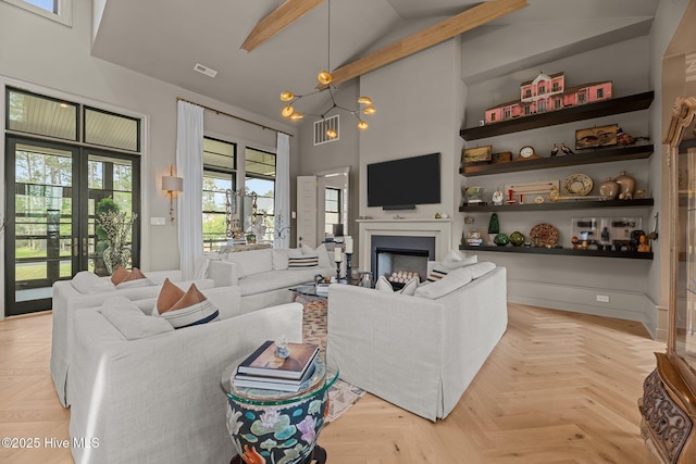 628 E Harborside Rd, Oriental, NC 28571 - living room with french doors, high vaulted ceiling, a fireplace, visible vents, and beamed ceiling