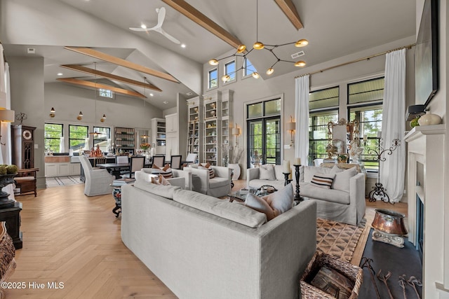 628 E Harborside Rd, Oriental, NC 28571 - living room featuring a fireplace, high vaulted ceiling, and beam ceiling