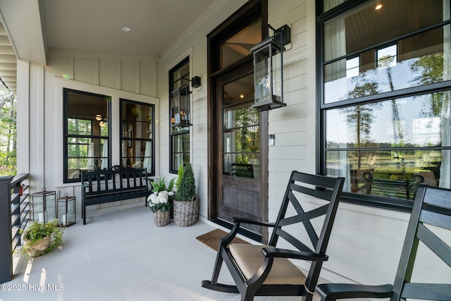 628 E Harborside Rd, Oriental, NC 28571 - property entrance featuring covered porch and board and batten siding