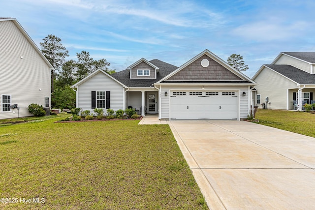 craftsman-style home with an attached garage, a front lawn, and concrete driveway