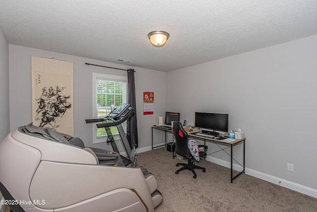 home office featuring carpet floors, baseboards, a textured ceiling, and visible vents