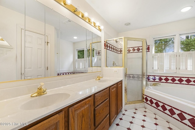 1601 Castalia Dr, Cary, NC 27513 - bathroom with a bath, a stall shower, double vanity, and tile patterned floors