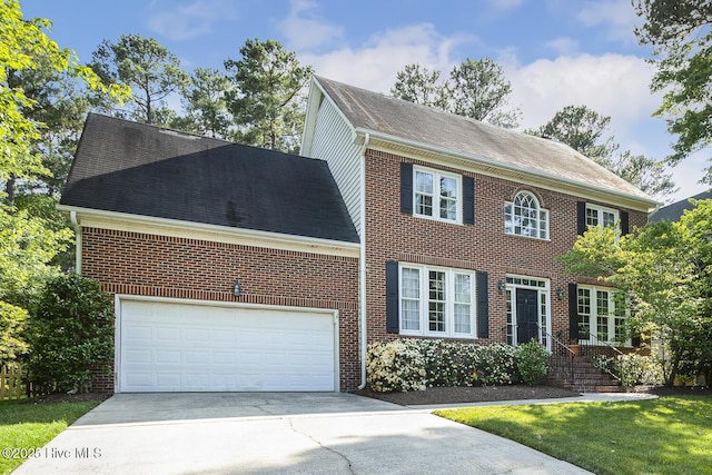 1601 Castalia Dr, Cary, NC 27513 - view of front of property featuring brick siding, concrete driveway, roof with shingles, and a garage