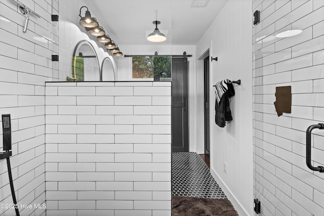 full bathroom featuring tiled shower