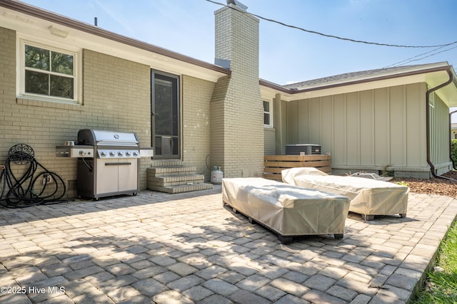 view of patio with grilling area and entry steps