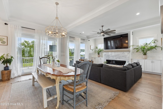 729 Waterstone Dr, Wilmington, NC 28411 - dining area featuring a ceiling fan, ornamental molding, a high end fireplace, light wood-type flooring, and recessed lighting