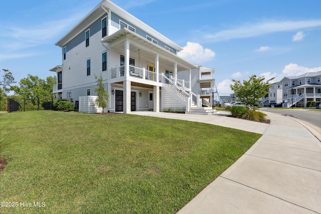 729 Waterstone Dr, Wilmington, NC 28411 - view of front of house with stairway, driveway, covered porch, and a residential view