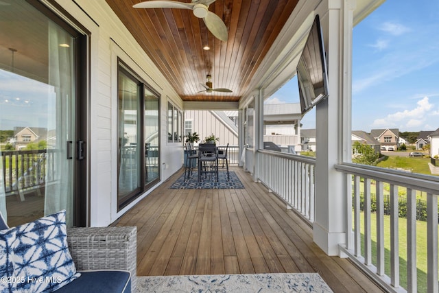 729 Waterstone Dr, Wilmington, NC 28411 - wooden deck with a ceiling fan, a residential view, and outdoor dining area
