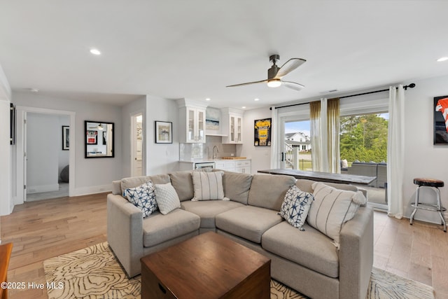 729 Waterstone Dr, Wilmington, NC 28411 - living area featuring light wood-style floors, baseboards, a ceiling fan, recessed lighting, and wet bar
