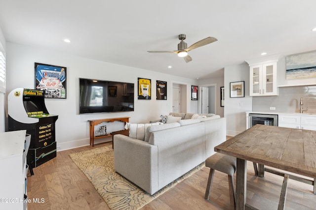 729 Waterstone Dr, Wilmington, NC 28411 - living room with bar with sink, a ceiling fan, light wood-style flooring, recessed lighting, and beverage cooler