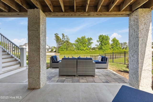729 Waterstone Dr, Wilmington, NC 28411 - view of patio / terrace featuring an outdoor hangout area, stairs, and fence