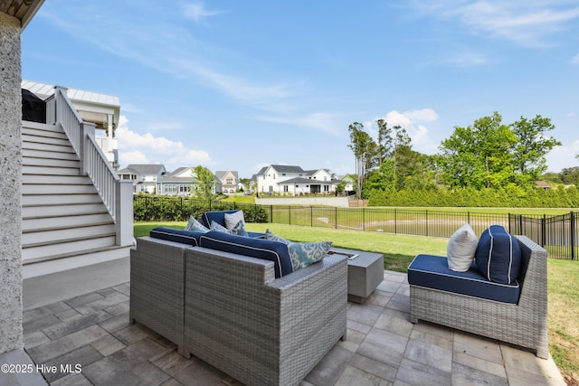 729 Waterstone Dr, Wilmington, NC 28411 - view of patio with outdoor lounge area, stairway, and a residential view