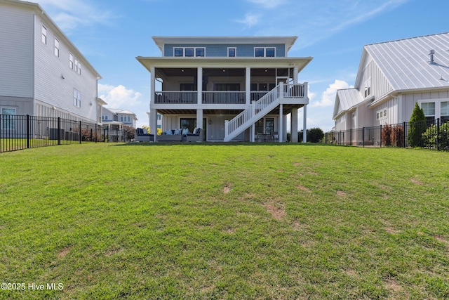 729 Waterstone Dr, Wilmington, NC 28411 - rear view of property with a sunroom and stairway