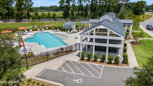 729 Waterstone Dr, Wilmington, NC 28411 - community pool featuring a patio area and view of scattered trees
