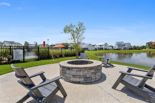 729 Waterstone Dr, Wilmington, NC 28411 - view of patio with a fire pit, a residential view, and a water view