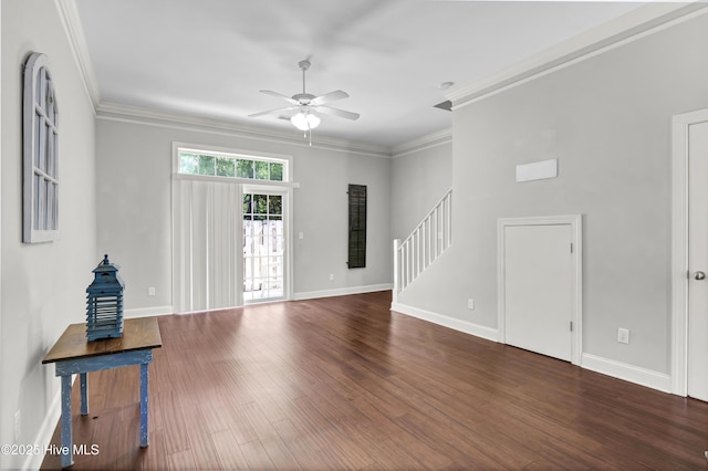 unfurnished living room featuring stairs, ceiling fan, baseboards, and wood finished floors