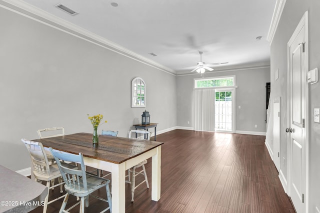 dining space featuring visible vents, crown molding, baseboards, and ceiling fan