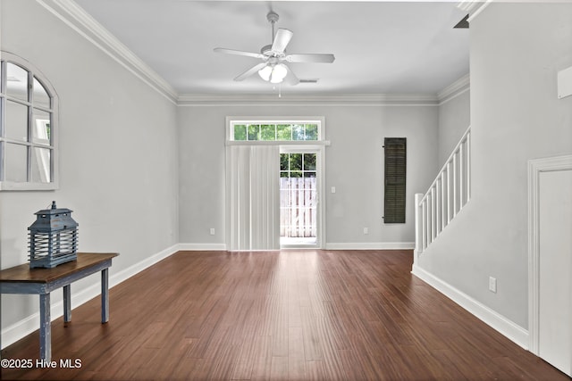 unfurnished living room featuring baseboards, a ceiling fan, wood finished floors, and stairway
