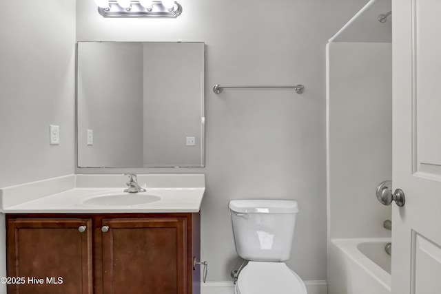 bathroom with vanity,  shower combination, and toilet