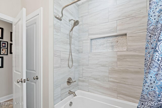 bathroom featuring shower / tub combo with curtain