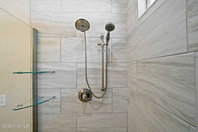 full bathroom with tiled shower