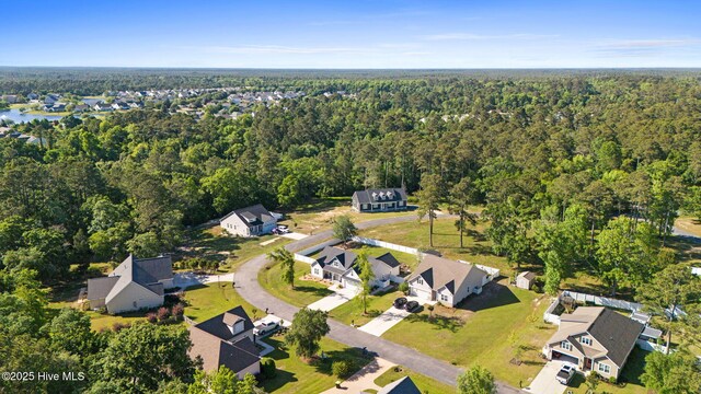 aerial view with a forest view and a residential view