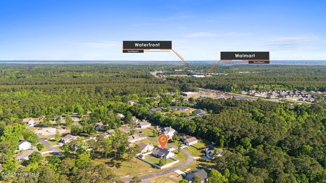 aerial view featuring a forest view