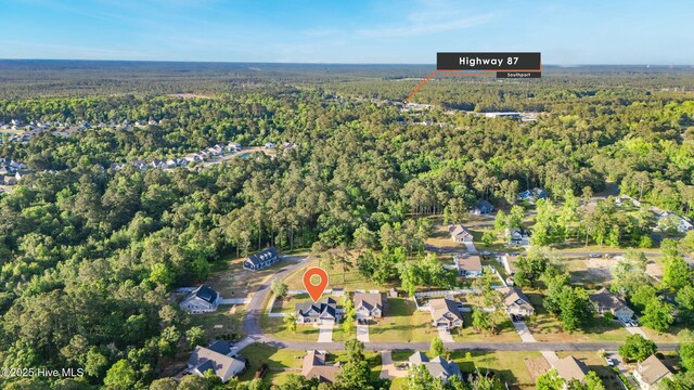 aerial view featuring a forest view