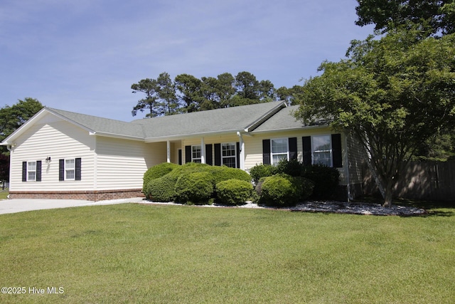 ranch-style house with fence and a front yard
