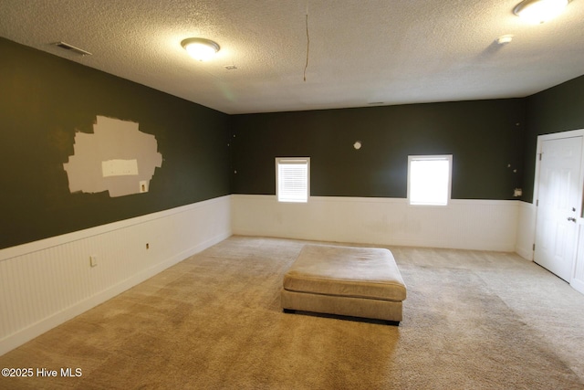 205 S Creek Dr, Jacksonville, NC 28540 - unfurnished room with wainscoting, carpet floors, and a textured ceiling