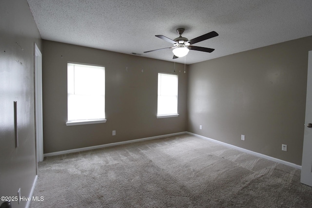 205 S Creek Dr, Jacksonville, NC 28540 - unfurnished room featuring a ceiling fan, a textured ceiling, carpet floors, and baseboards