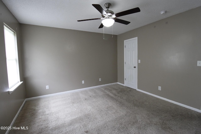 205 S Creek Dr, Jacksonville, NC 28540 - carpeted empty room with ceiling fan, a smoke detector, a textured ceiling, and baseboards