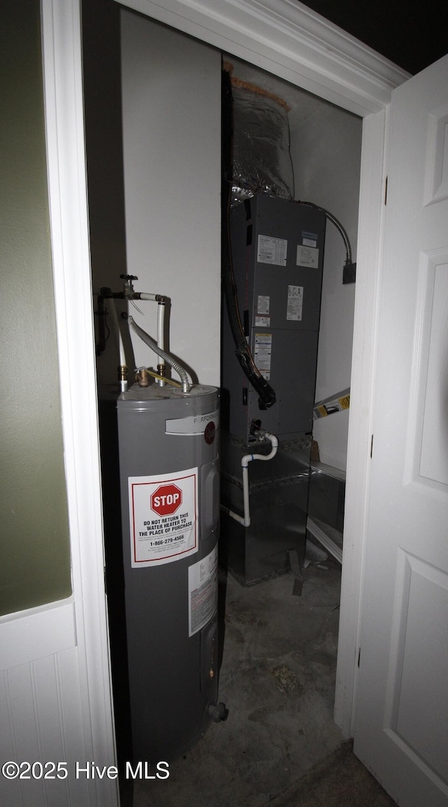 utility room featuring water heater