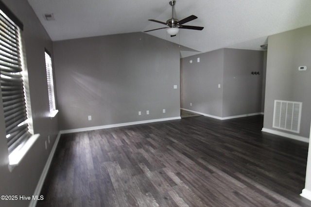 205 S Creek Dr, Jacksonville, NC 28540 - unfurnished living room featuring vaulted ceiling, ceiling fan, baseboards, and dark wood-style flooring
