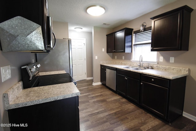 205 S Creek Dr, Jacksonville, NC 28540 - kitchen featuring appliances with stainless steel finishes, a sink, dark wood-type flooring, and baseboards