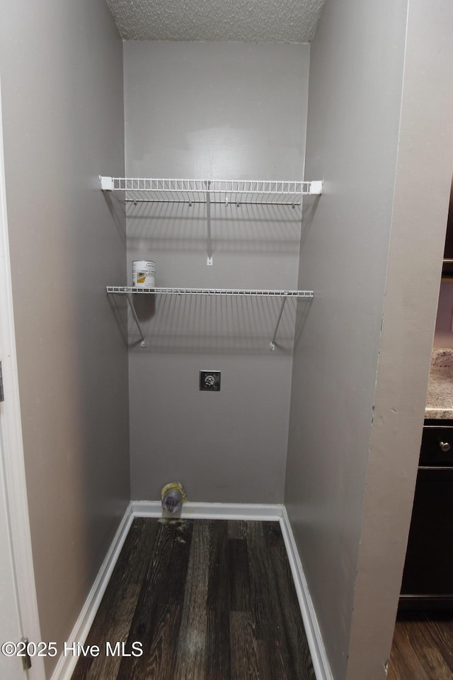 205 S Creek Dr, Jacksonville, NC 28540 - washroom featuring hookup for an electric dryer, wood finished floors, baseboards, and a textured ceiling
