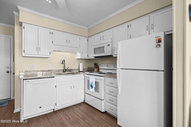 kitchen with white appliances, a sink, ornamental molding, dark wood-style flooring, and white cabinetry