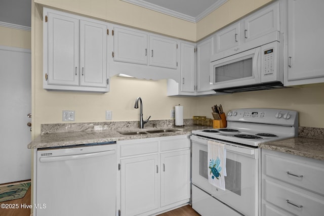 kitchen featuring white appliances, a sink, crown molding, white cabinetry, and wood finished floors