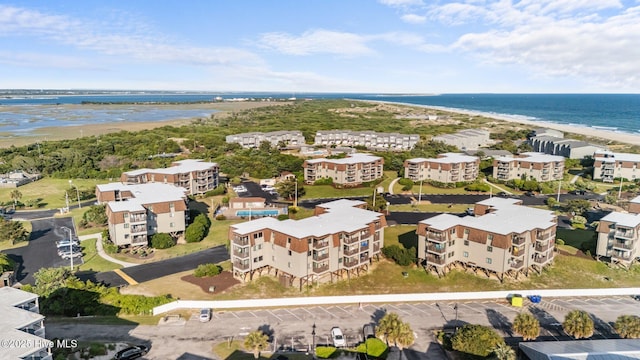 bird's eye view of a nearby body of water and apartment complex / building