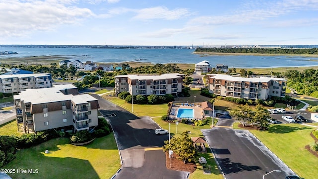bird's eye view of apartment complex / building and a large body of water