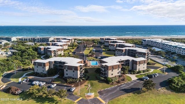 bird's eye view of a large body of water and apartment complex
