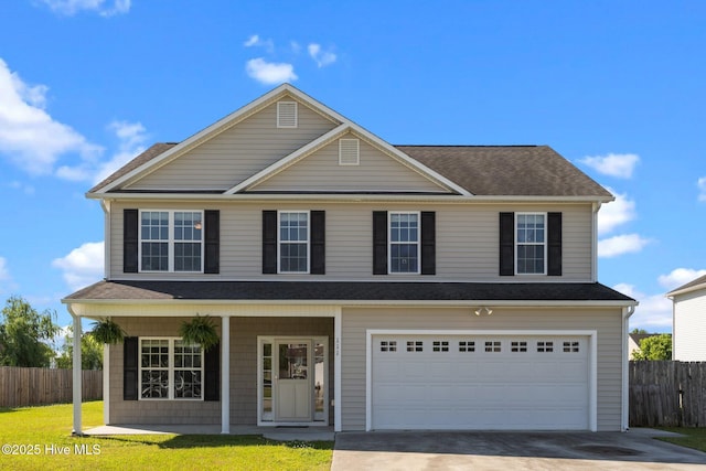 traditional-style house featuring fence, concrete driveway, a porch, and a garage